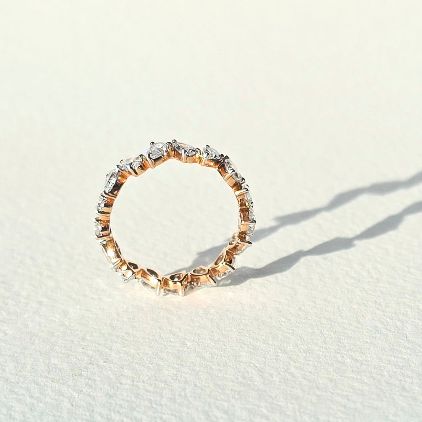elara-ring-14k-rose-gold-pear-cut-lab-diamond-eternity-band