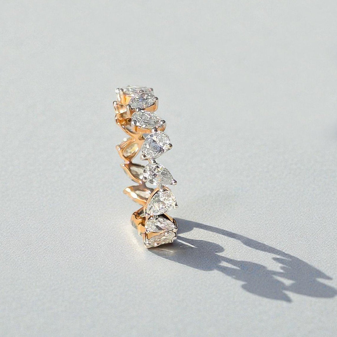 elara-ring-14k-rose-gold-pear-cut-lab-diamond-eternity-band- (14)