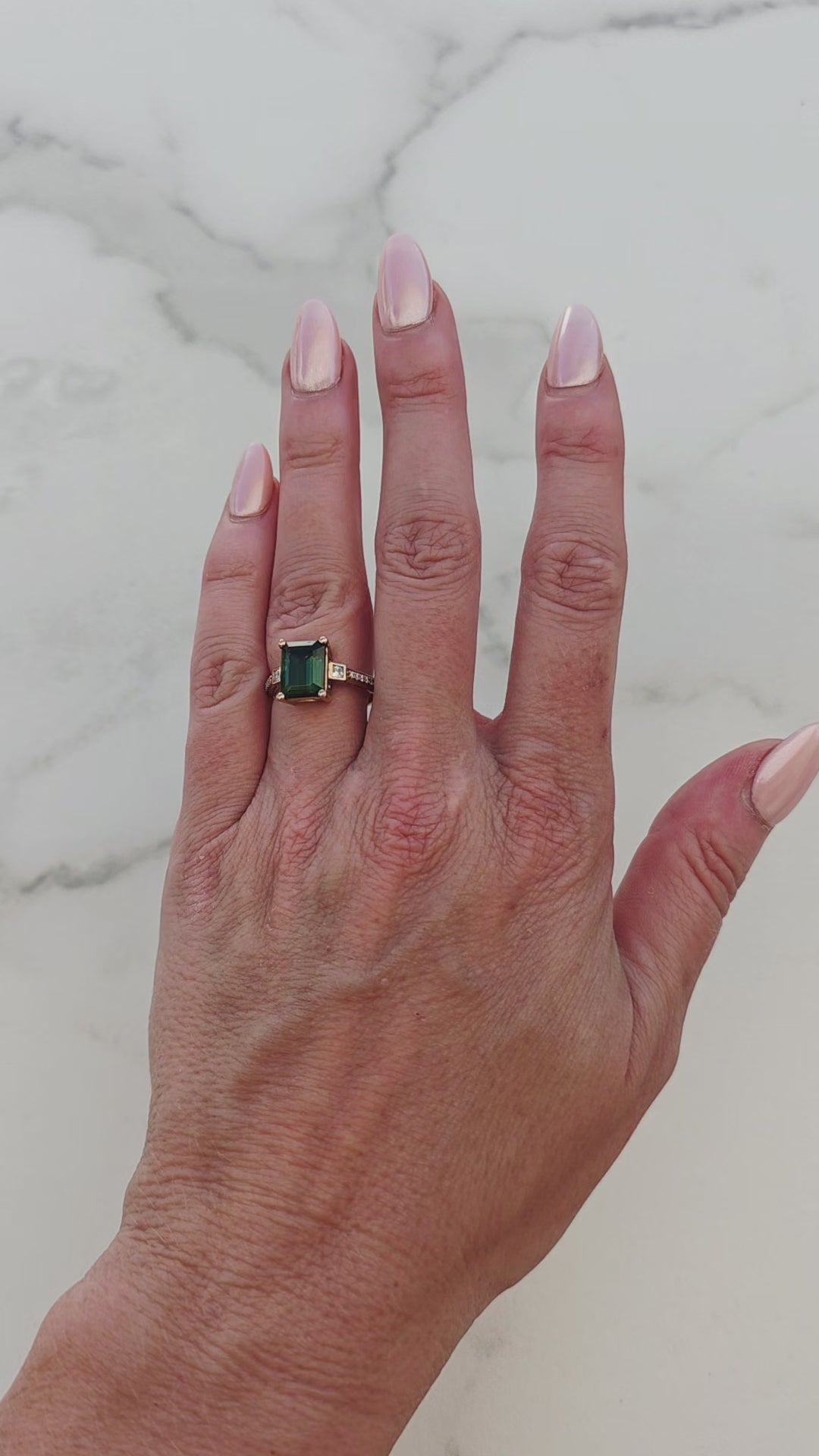 Green-tourmaline-rose-gold-emerald-cut-moissanite-solitaire-engagement-ring-vid